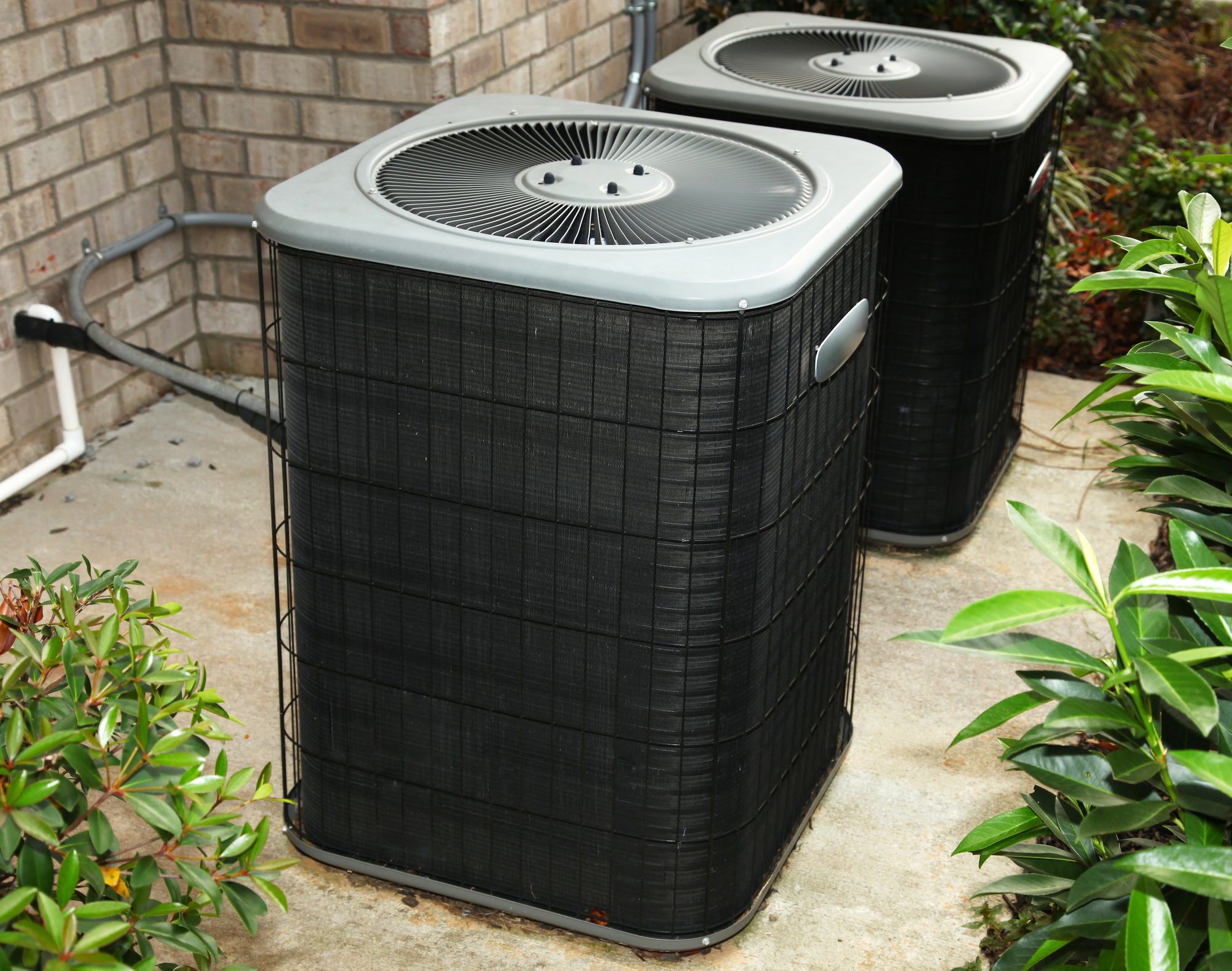 Residential Central Air Conditioning Unit on cement slab
